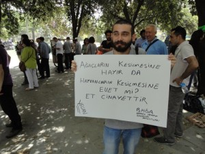 Protester's sign: “No to cutting trees, but yes to cutting animals?  Meat is murder”