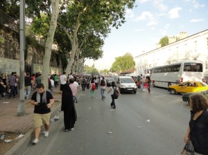 Approaching the police in Beşiktaş.  The man in pink behind the woman in black would speak to us