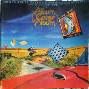 Front cover of The Album Cover Album, showing album covers (Grateful Dead, Who, unknown, Beatles, Camel, Pink Floyd, King Crimson) scattered like leaves in the air over brown rolling farmland beyond the red hood of a car