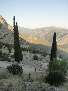 View down into the valley between cypresses