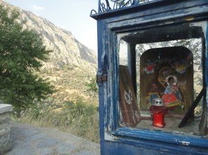Roadside shrine with icons of mother and child and of a saint