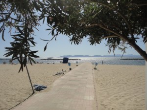 Beach with concrete walk to sea