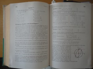Two-page spread of textbook, with the concentric circle and ellipse shown above in detail