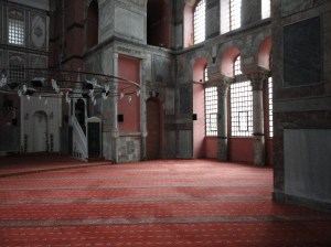 The array of windows described earlier are seen from inside; below them, carpet